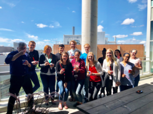 Group photo of CHRIM members on balcony of 5th floor JBRC.
