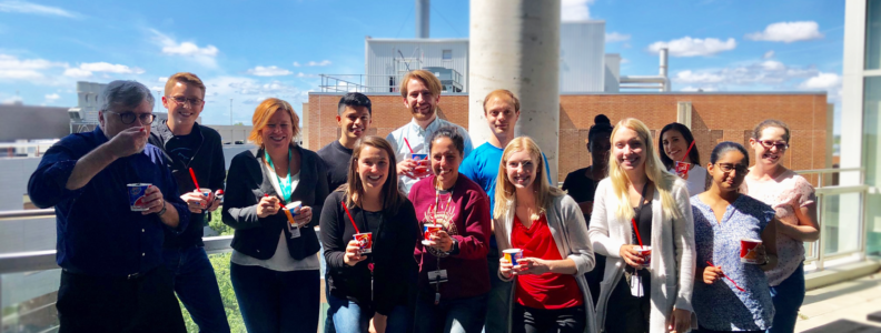 Group photo of CHRIM members on balcony of 5th floor JBRC.