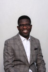 Headshot of Alex Aregbesola